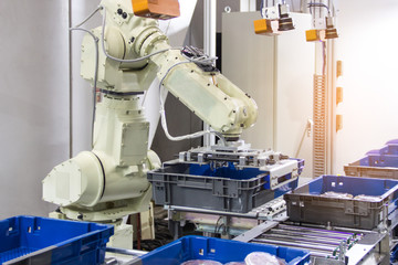 Industry 4.0 Robot concept .The robot arm is working smartly in the shipping department of the factory.