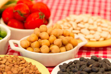 variety of kitchen ingredients with fresh and dried legumes
