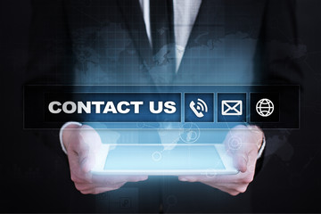 Contact us button and text on virtual screen. Business and technology concept.