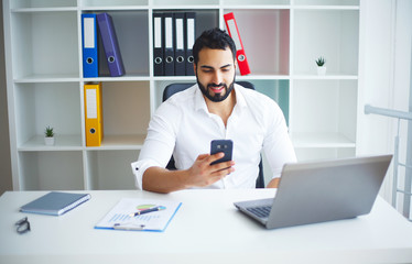 Man Working At Computer In Contemporary Office