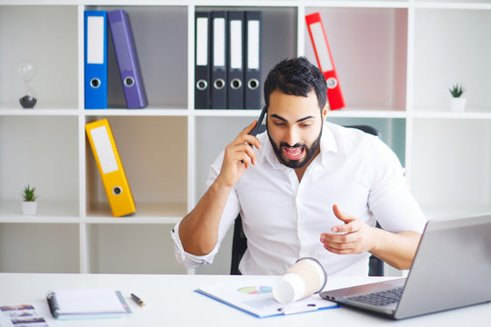 Businessman Spilling Coffee On Important Documents