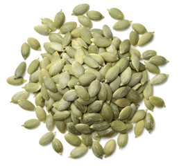 raw pumpkin seeds isolated on white, top view