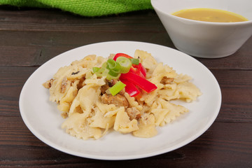 Wholemeal pasta baked with cabbage on a table