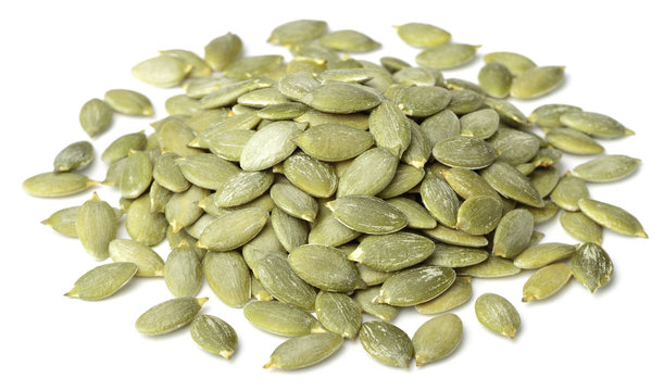 raw pumpkin seeds isolated on white