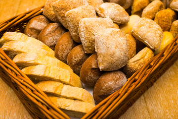 Fresh bread on a wicker basket in the form of a tray