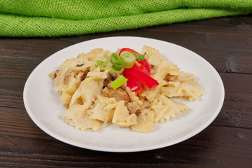 Wholemeal pasta baked with cabbage on a table
