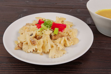 Wholemeal pasta baked with cabbage on a table