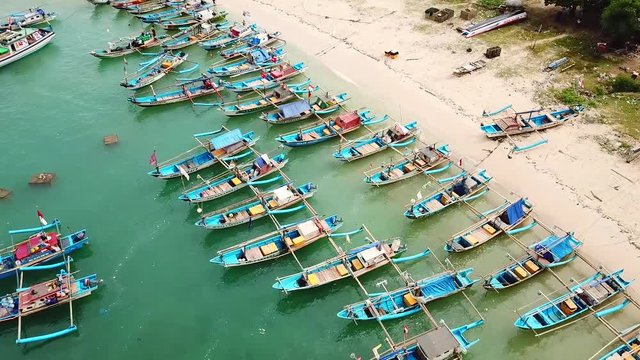Sukabumi, West Java - Indonesia. April 12, 2018: Beautiful aerial view of anchored fisherman boats on the Ujung Genteng beach at Sukabumi, West Java, Indonesia