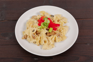 Wholemeal pasta baked with cabbage on a table