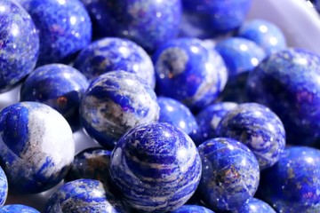 Cobalt blue lapis lazuli balls. Selected focus. Minerals exhibition.