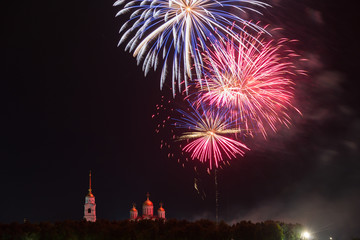 Fototapeta na wymiar Big festive fireworks over the Assumption Cathedral in Vladimir, Russia