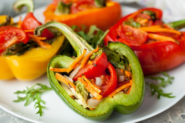 Baked bell peppers stuffed with vegetables