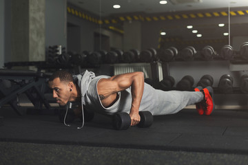 Fototapeta na wymiar Young man fitness workout, push ups or plank