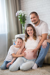 Family with a child and a pregnant mother