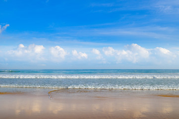 Deserted sandy beach of the Indian Ocean and blue sky,