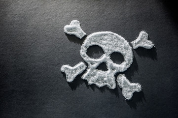 skull made of sugar, sugar crystals in the shape of a skull on a dark background, concept about the dangers of sugar