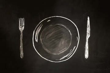 Menu restaurant on a plate with a fork on the side in retro style drawing with chalk on blackboard.