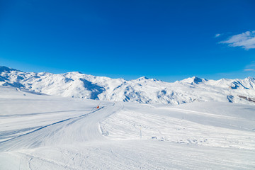 Fototapeta na wymiar Alpine winter landscape of slopes and off piste skiing, in the highest French resort of Val Thorens, Les Trois Vallees