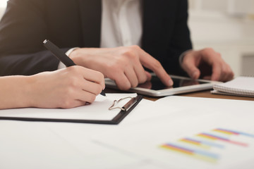 Fototapeta premium Business colleagues using tablet and working with documents
