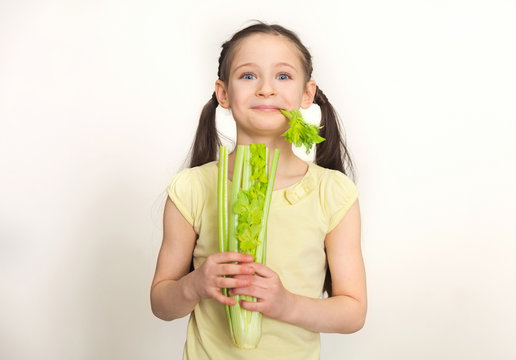 Pretty Cute Little Girl Eating Celery Leaves