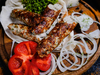 shish kebab. Charred meat and fresh onions and peppers. Traditional Georgian food. Delicious restaurant meal