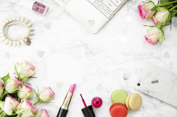 women's accessories with roses on a marble background