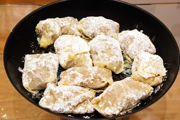 Prepared in a pan for further cooking stuffed cabbage.