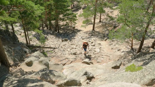 Man hiking in wooded forest at Lake Borovoe in Kazakhstan