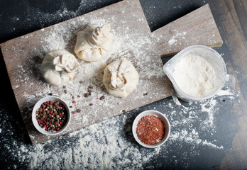 Preparation of baking from flour and dough, ravioli or pie with chicken. Banner for a bakery.