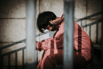 Men desperate to catch the iron prison,prisoner concept,thailand people,Hope to be free,A person...