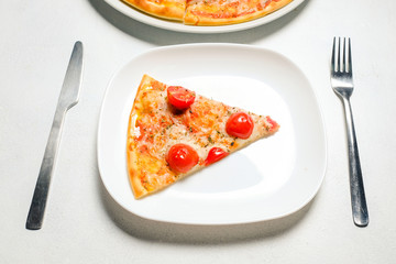 pizza slice on a plate on white background. traditional italian cuisine restaurant. pizzeria menu