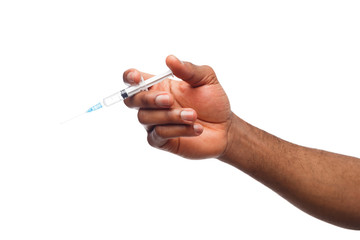Black male hand holding a plastic syringe