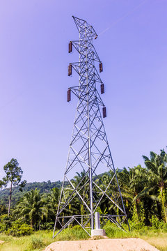Un-finished construction of high voltage transmission tower in Thailand against the blue sky background