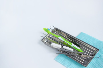 Group of tools and accessories for dental treatment and prevention.