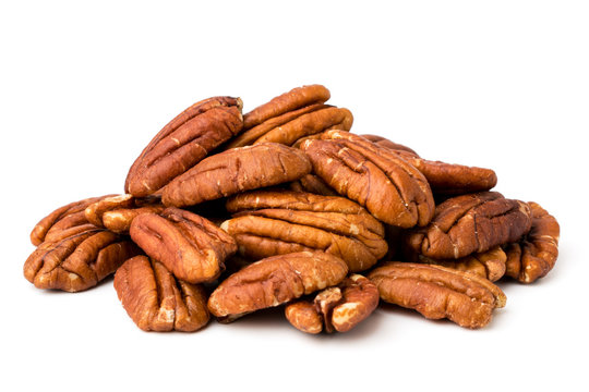 A bunch of peeled pecans on a white, isolated.