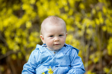 Adorable child, playing in the grass in park