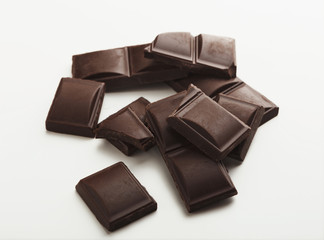 Bar of dark chocolate isolated on white