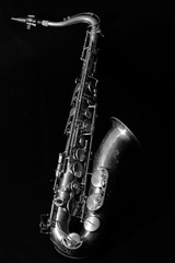 Obraz premium Black and white of tenor sax on black background