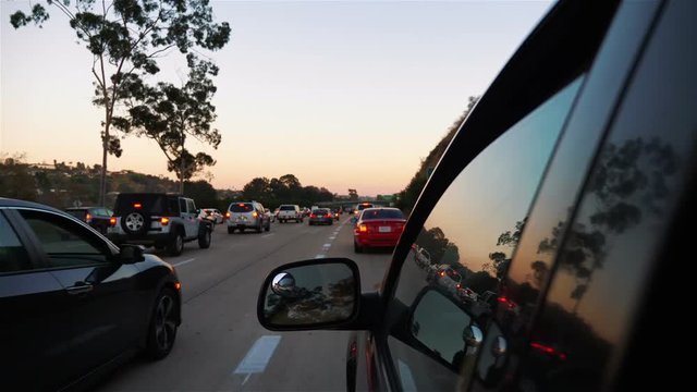 Professional video of cars driving in traffic jam on 5 highway in California in slow motion 180fps