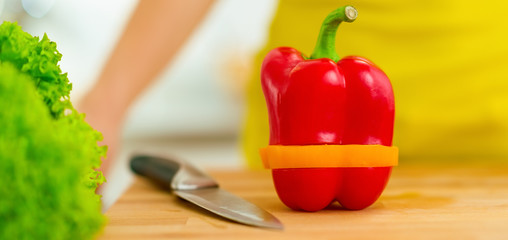 Closeup on red bell pepper with yellow slice
