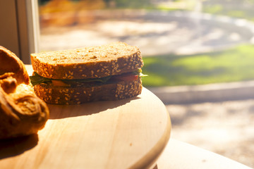 Breakfast food. Homemade breads or bun on wood background, croissant puff cinnamon. Have a nice day