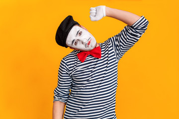 Suicide, bad emotions. Mime man holding rope on his neck