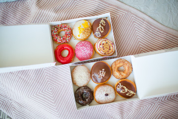 Colorful sweet donuts in box