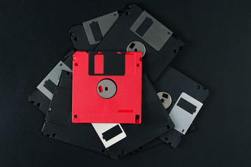 Old disks on a black background. View from above.