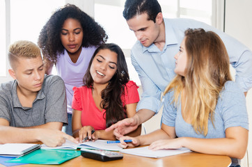 Teacher with male and female students