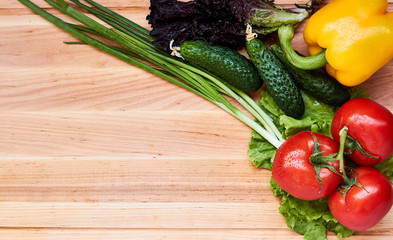 Fresh vegetables variety on the wooden table. Food layout. Copy space