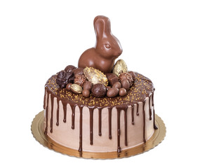 Chocolate cake for Easter with sweets and rabbit.