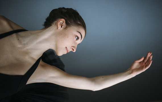 Young ballet dancer practicing in studio