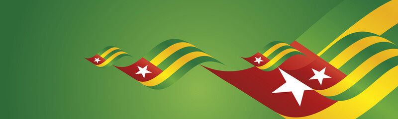 Togo Independence Day waving flags two fold green landscape background