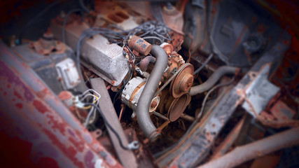 Fototapeta premium A close up view of an old rusty car engine.